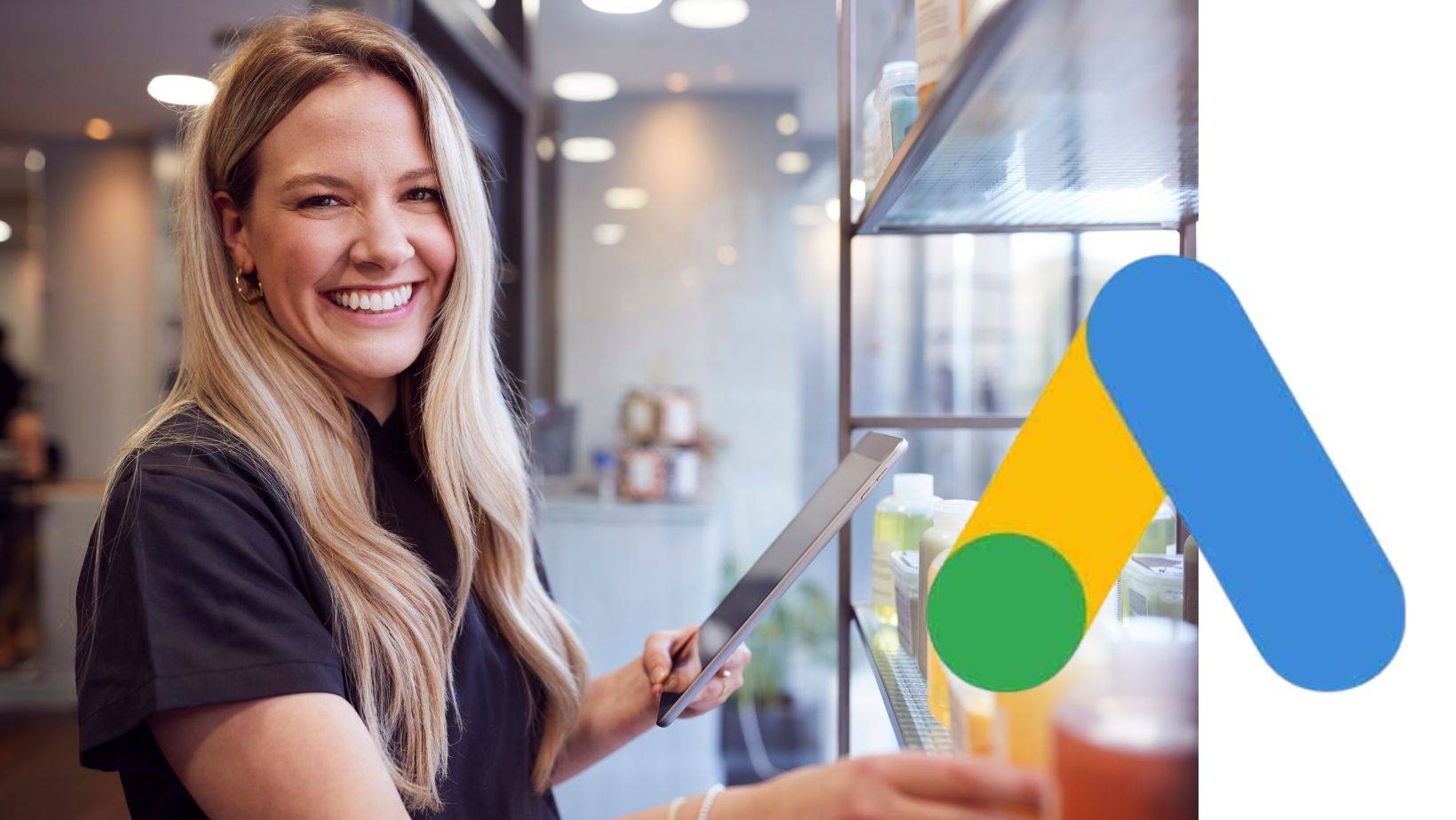 Smiling business owner using tablet with Google Local Services Ads logo, optimizing LSA for lead generation